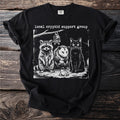 Black t-shirt with "local cryptid support group" text and raccoon, possum, bat, cat, and frog illustration.