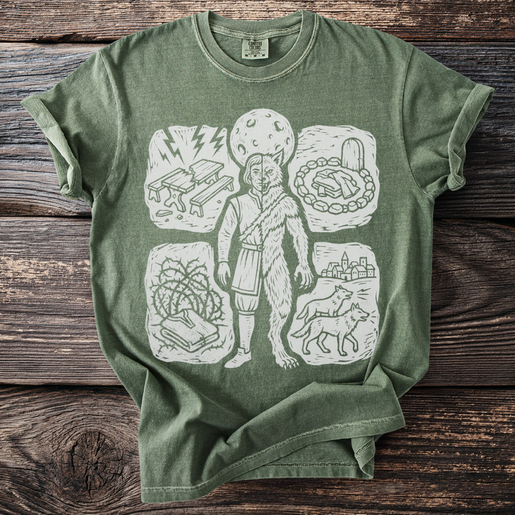 Green t-shirt with a linocut print of a werewolf and surrounding vignettes.