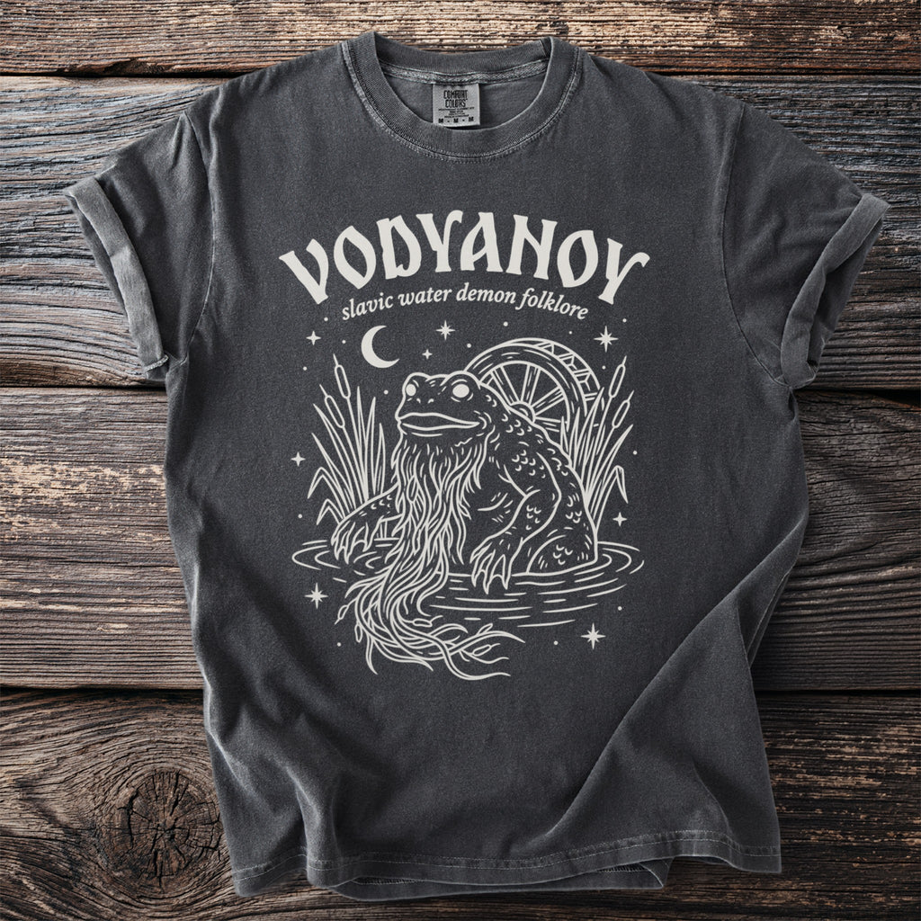 Dark grey t-shirt with white graphic of a frog-like creature with long beard and a water wheel.