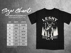 Black t-shirt with Leshy graphic. Size chart shows measurements in inches for sizes S-4XL.