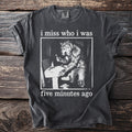Dark grey t-shirt with white text "i miss who i was" and a werewolf brushing teeth.