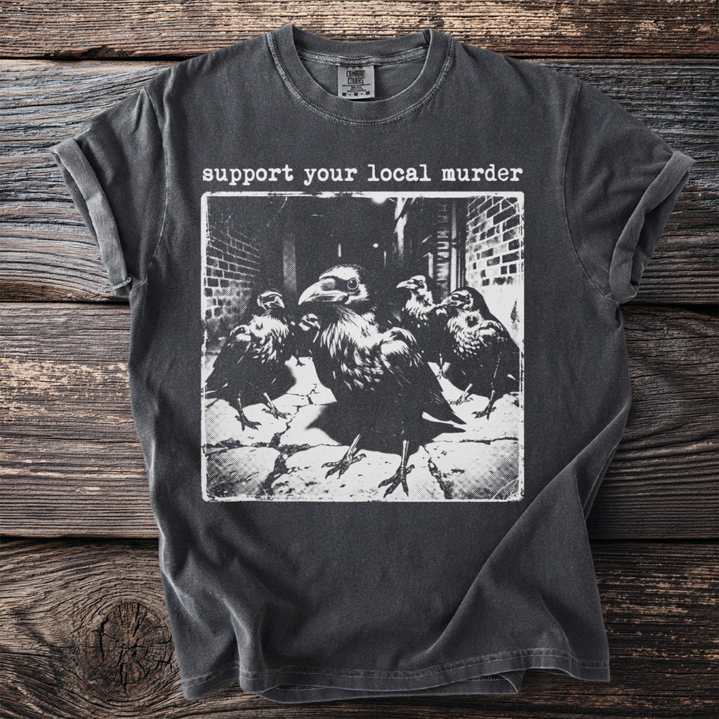 Dark t-shirt with "support your local murder" text and black and white image of crows.