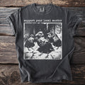 Dark t-shirt with "support your local murder" text and black and white image of crows.
