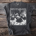 Dark t-shirt with "support your local murder" text and black and white image of crows.
