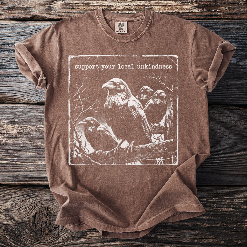 Brown t-shirt with ravens and the text "support your local unkindness".