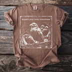 Brown t-shirt with ravens and the text "support your local unkindness".