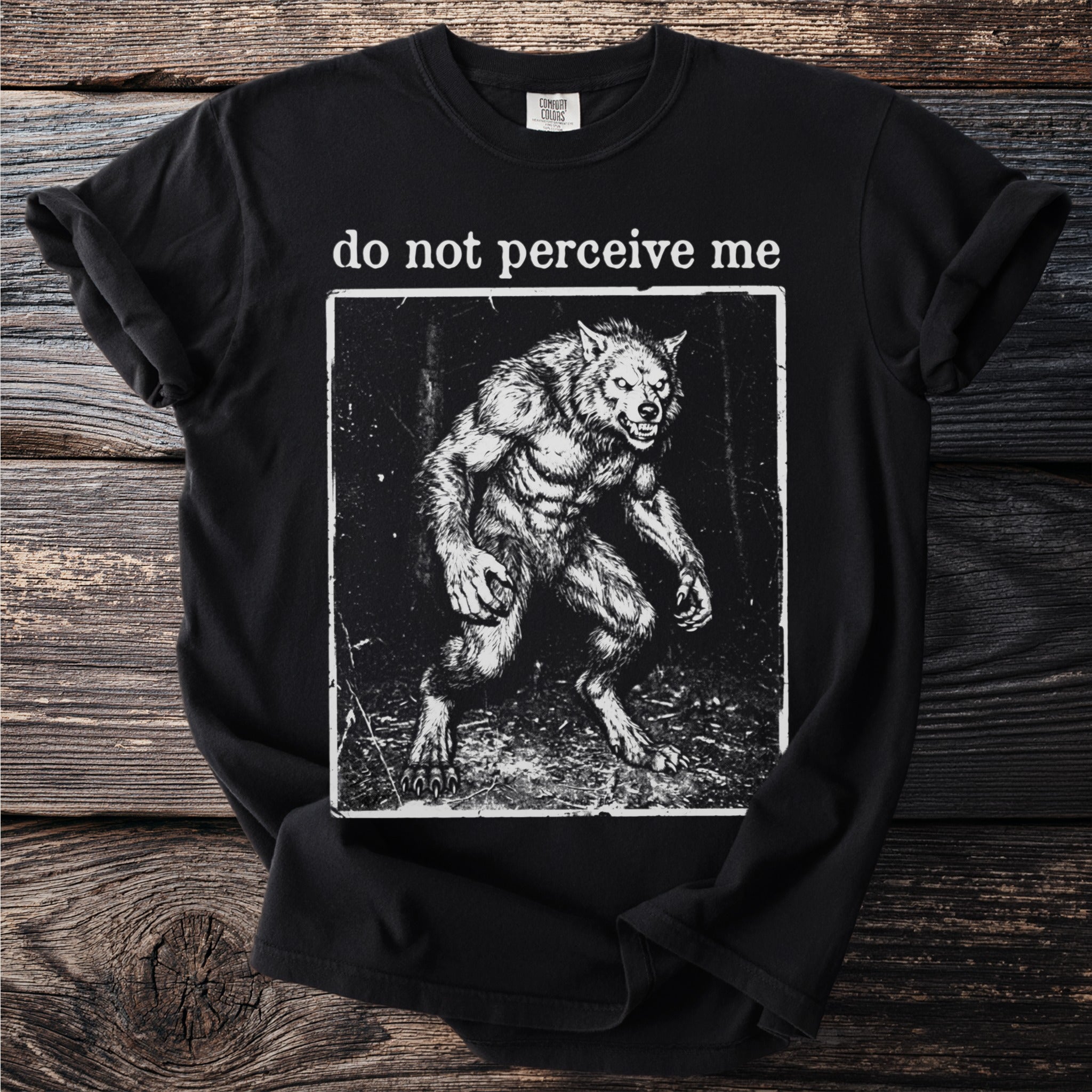 Black t-shirt with a werewolf graphic and text "do not perceive me".