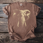 Brown t-shirt with a light beige elephant graphic and "COMFORT COLORS" tag.