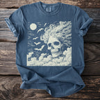 T-shirt with a cream-colored skull, bats, and moon graphic on dark blue fabric.