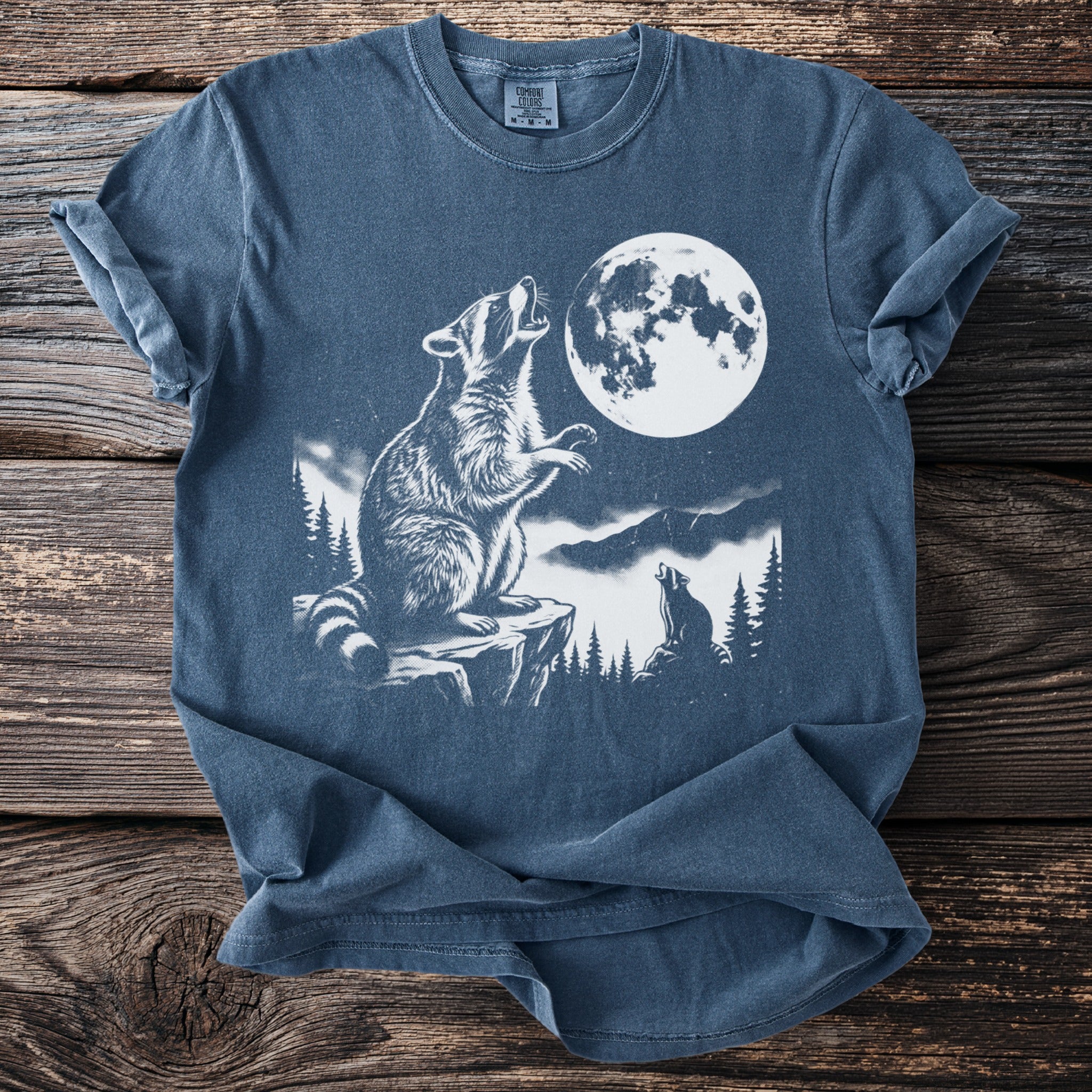 Raccoon howling at the moon with another raccoon in the background.