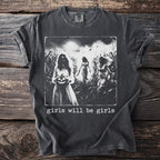 Vintage-style t-shirt graphic of three girls in a cornfield with a pumpkin and knife, text "girls will be girls".