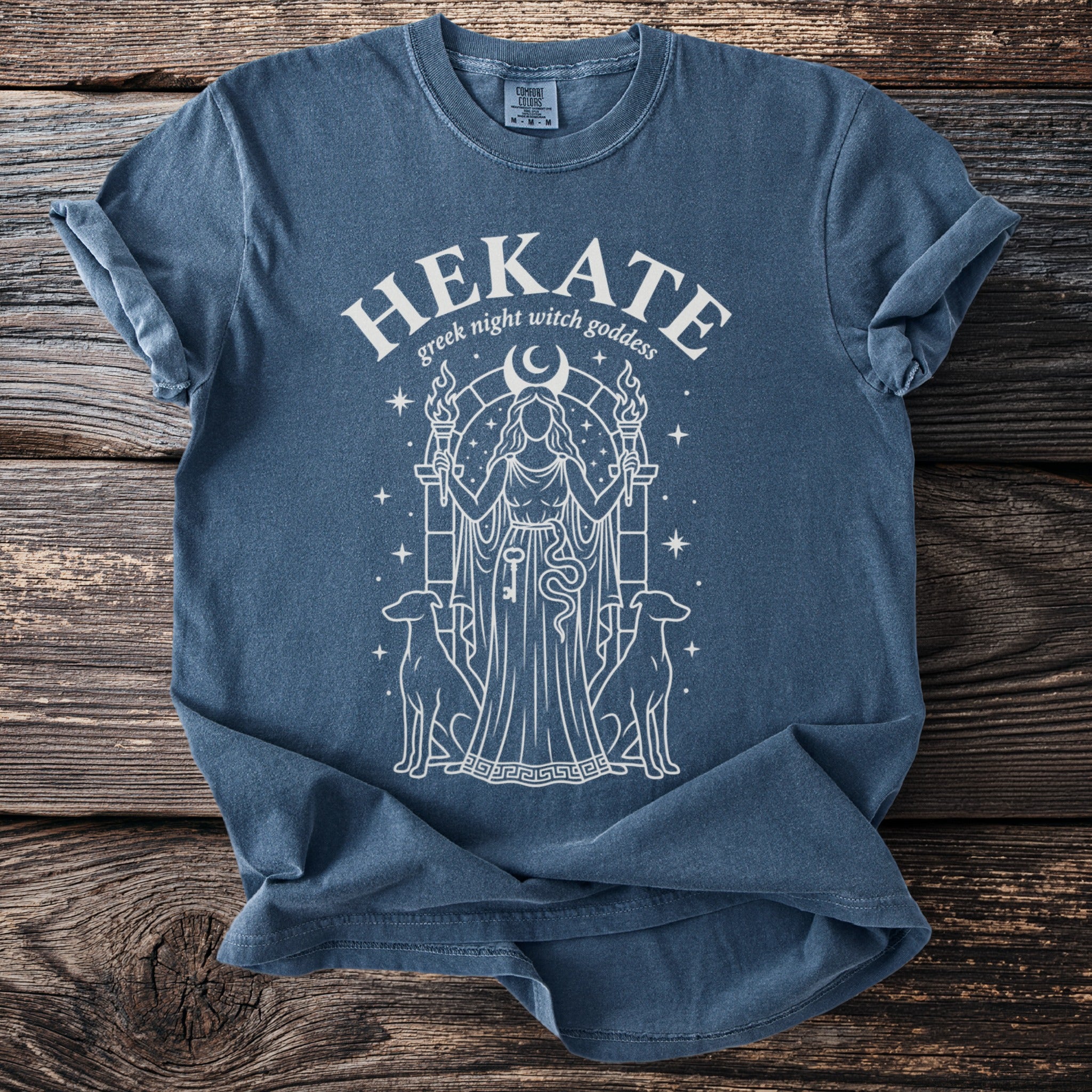 Blue t-shirt with "Hekate greek night witch goddess" text and a central goddess illustration.