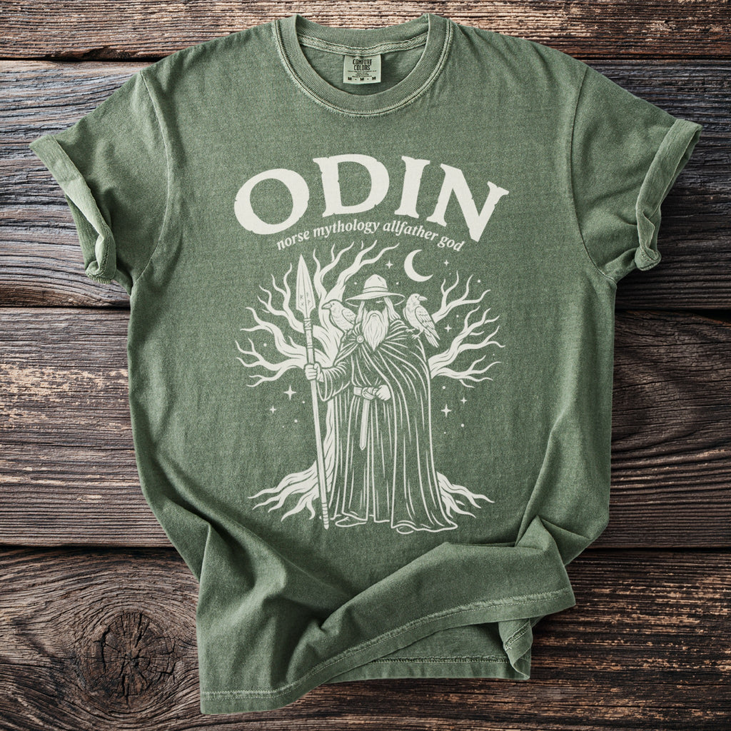 Green t-shirt with Odin, norse mythology allfather god, and tree graphic.