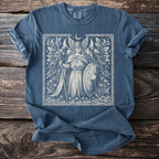 Blue t-shirt with a white ink linocut-style print of a winged warrior with a shield and spear.