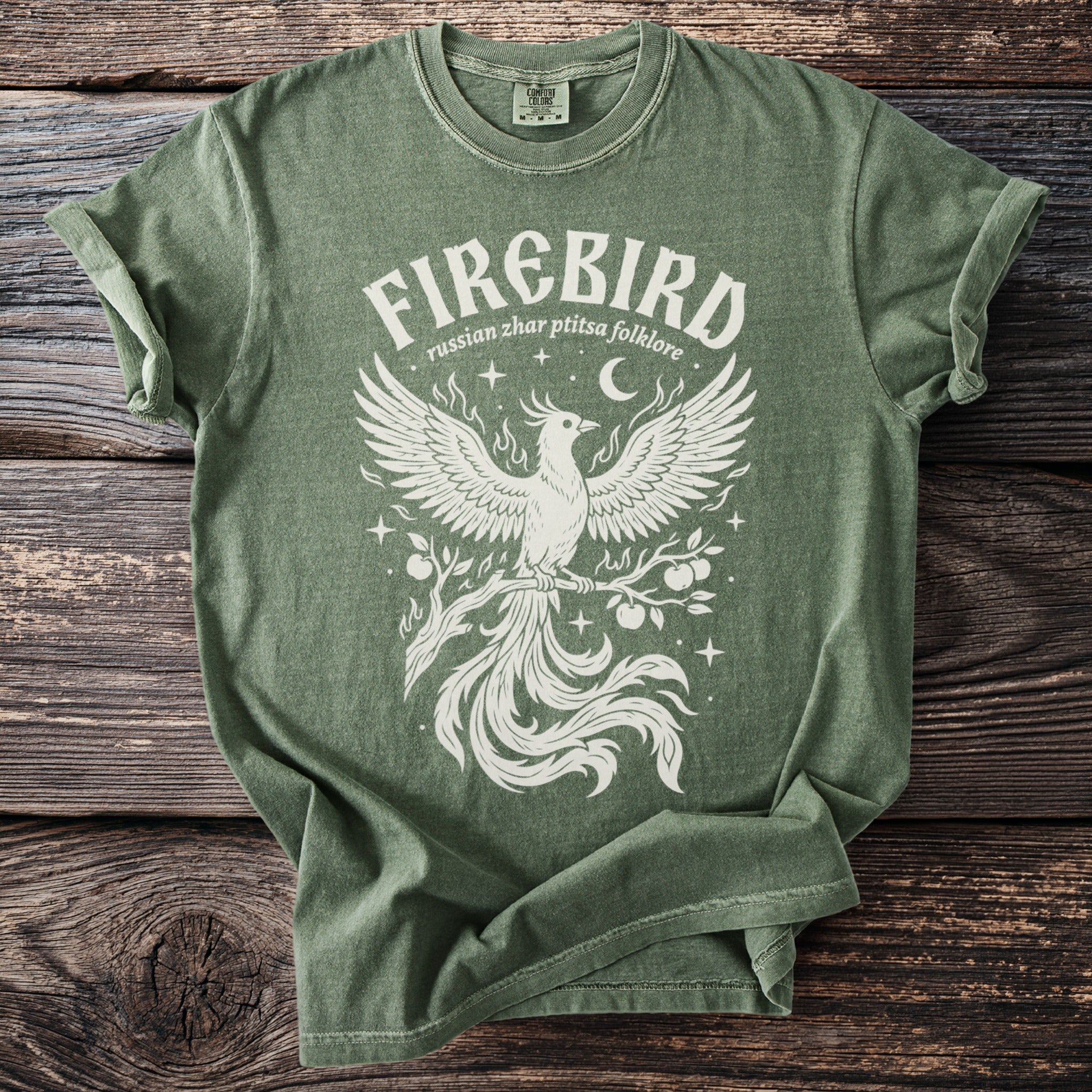 Green t-shirt with white 'Firebird russian zhar ptitsa folklore' graphic featuring a phoenix.