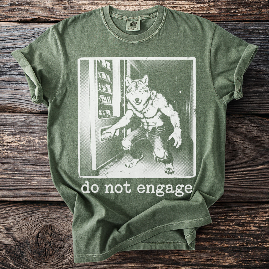 Olive green t-shirt with werewolf and vending machine graphic, saying "do not engage".
