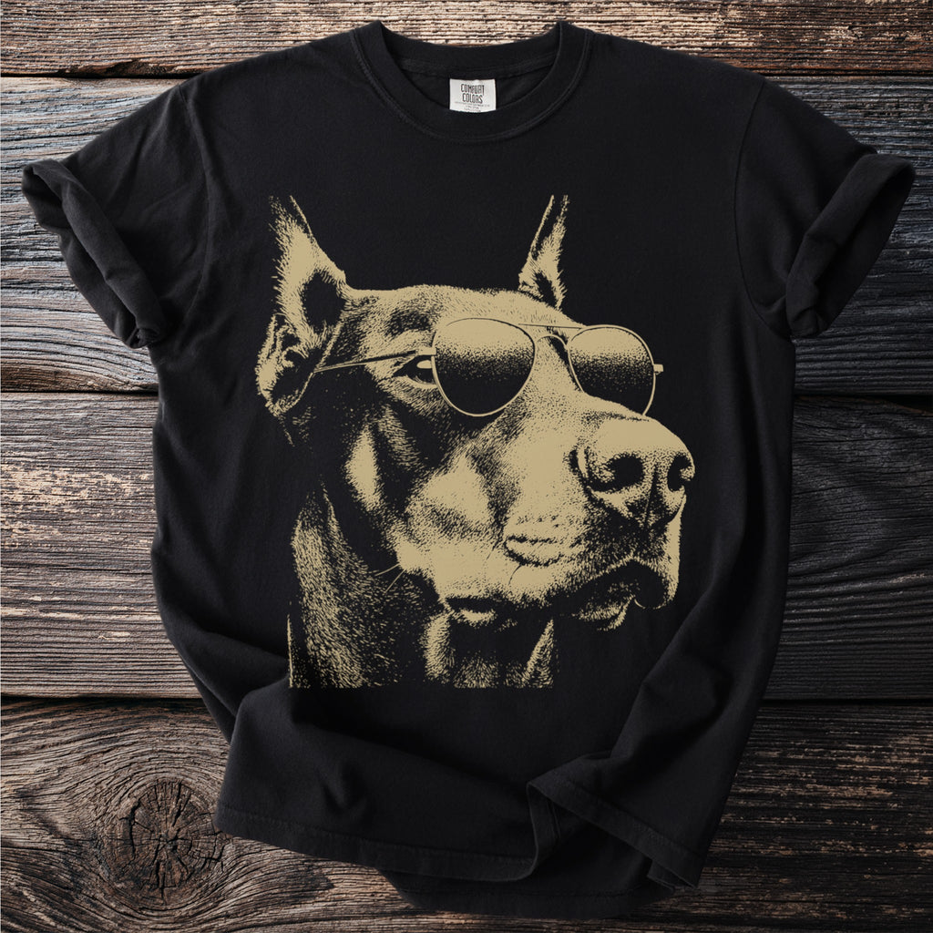 Black t-shirt with a gold line art illustration of a Doberman wearing sunglasses.