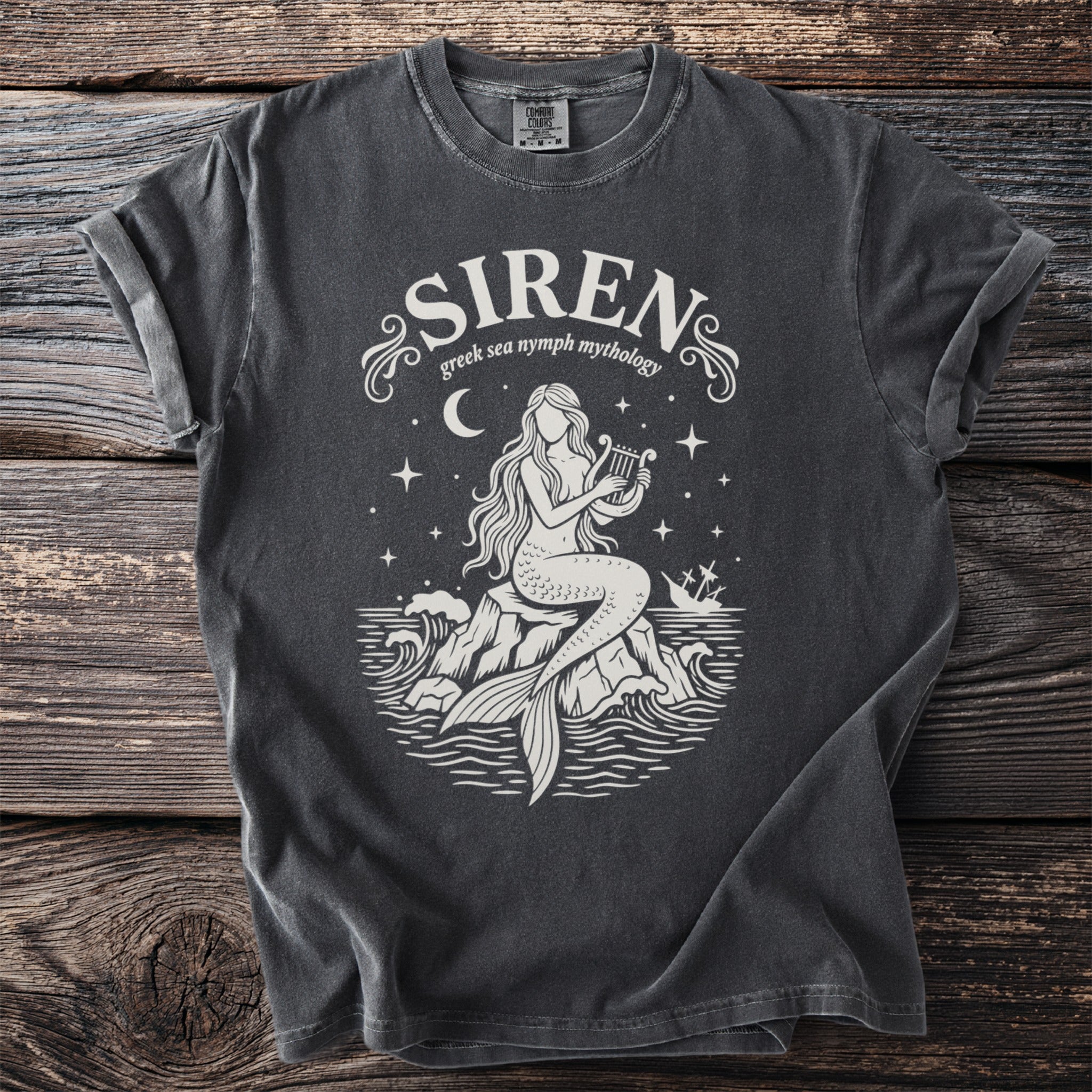 Dark grey t-shirt with a white siren playing a lyre on rocks, text "SIREN greek sea nymph mythology".
