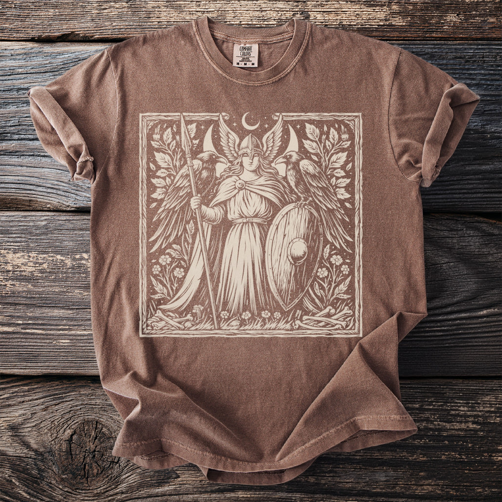 Brown t-shirt with a cream linocut style print of a winged warrior with a spear and shield.