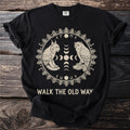Black t-shirt with light graphic of lynx and owl facing each other, text "WALK THE OLD WAY".