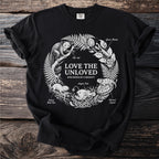 Black t-shirt with "LOVE THE UNLOVED SPECIMENS OF CURIOSITY" and wreath of creatures.