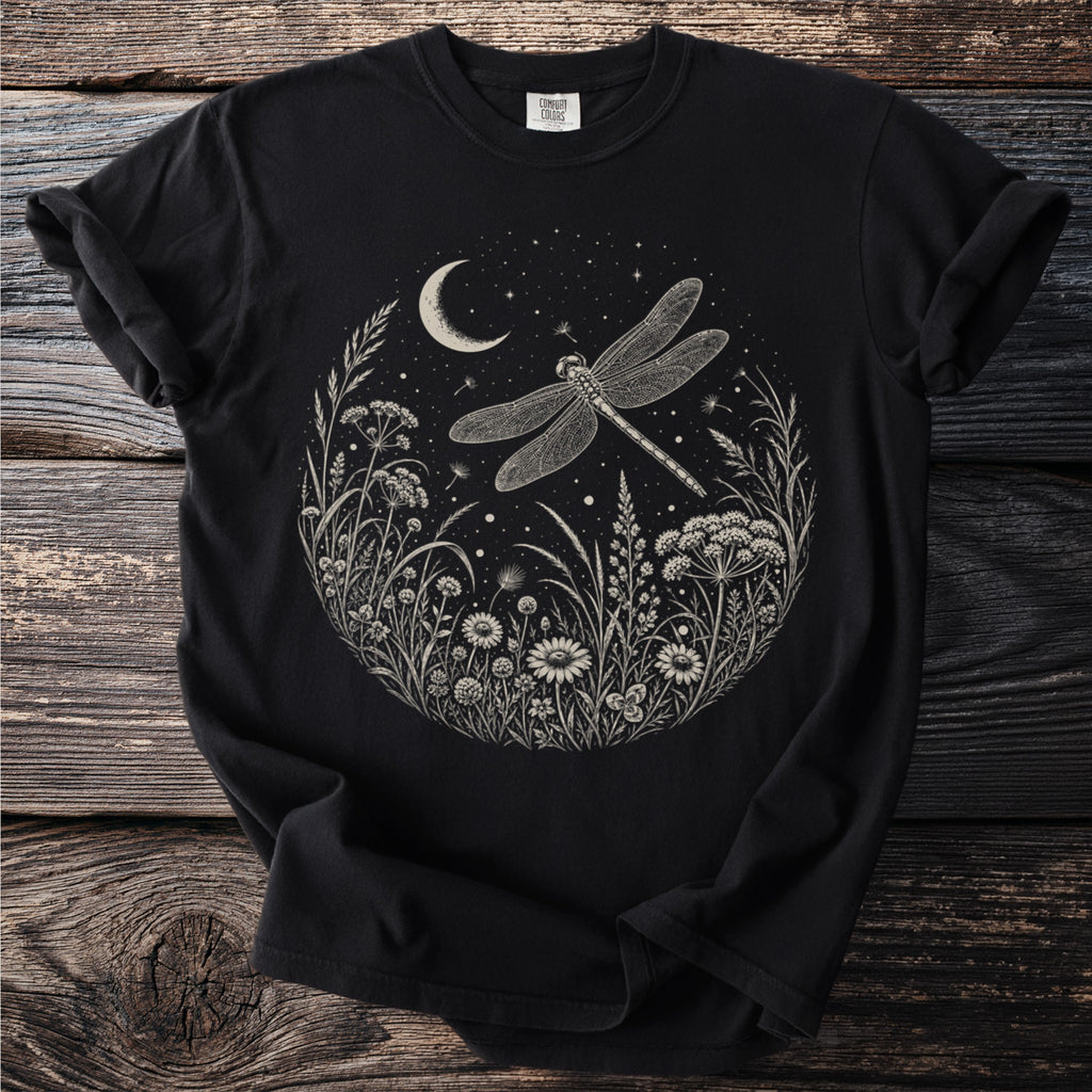 Black t-shirt with a circular white graphic of a dragonfly over a crescent moon and starry night sky.