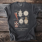 Dark grey t-shirt with graphic of protective talismans and their names like Khamsa, Vegvísir, Witch Bottle.