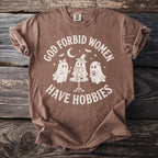 Brown t-shirt with "God forbid women have hobbies" and ghost graphic.
