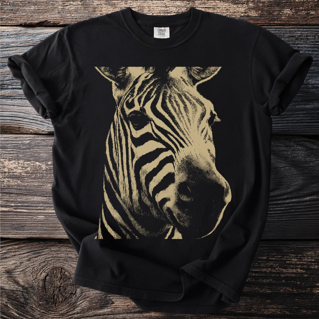 Black t-shirt with a gold and black minimalist zebra face graphic.