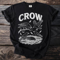 Black t-shirt with white crow graphic and text.