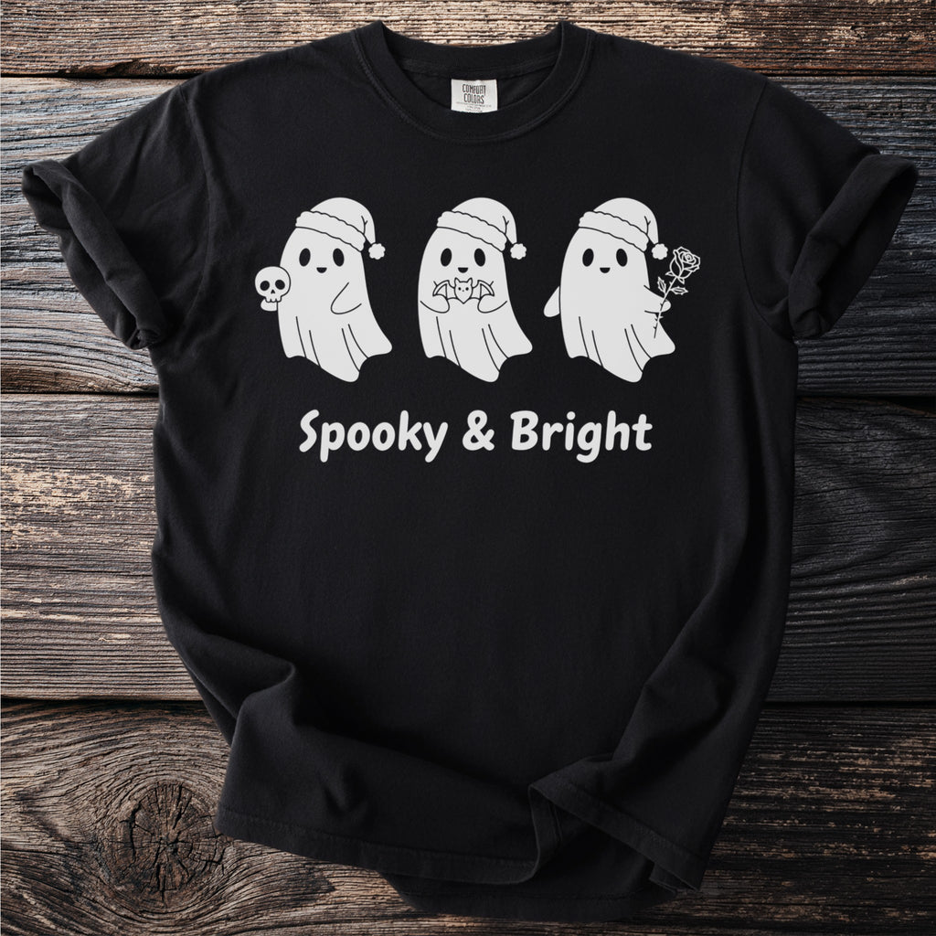 Black t-shirt with three white ghosts wearing Santa hats and text "Spooky & Bright."