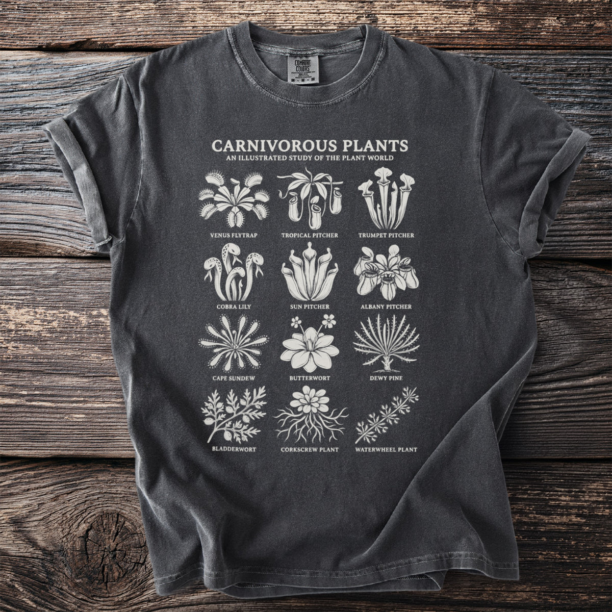 Dark t-shirt with white illustrations of various carnivorous plants and their names.