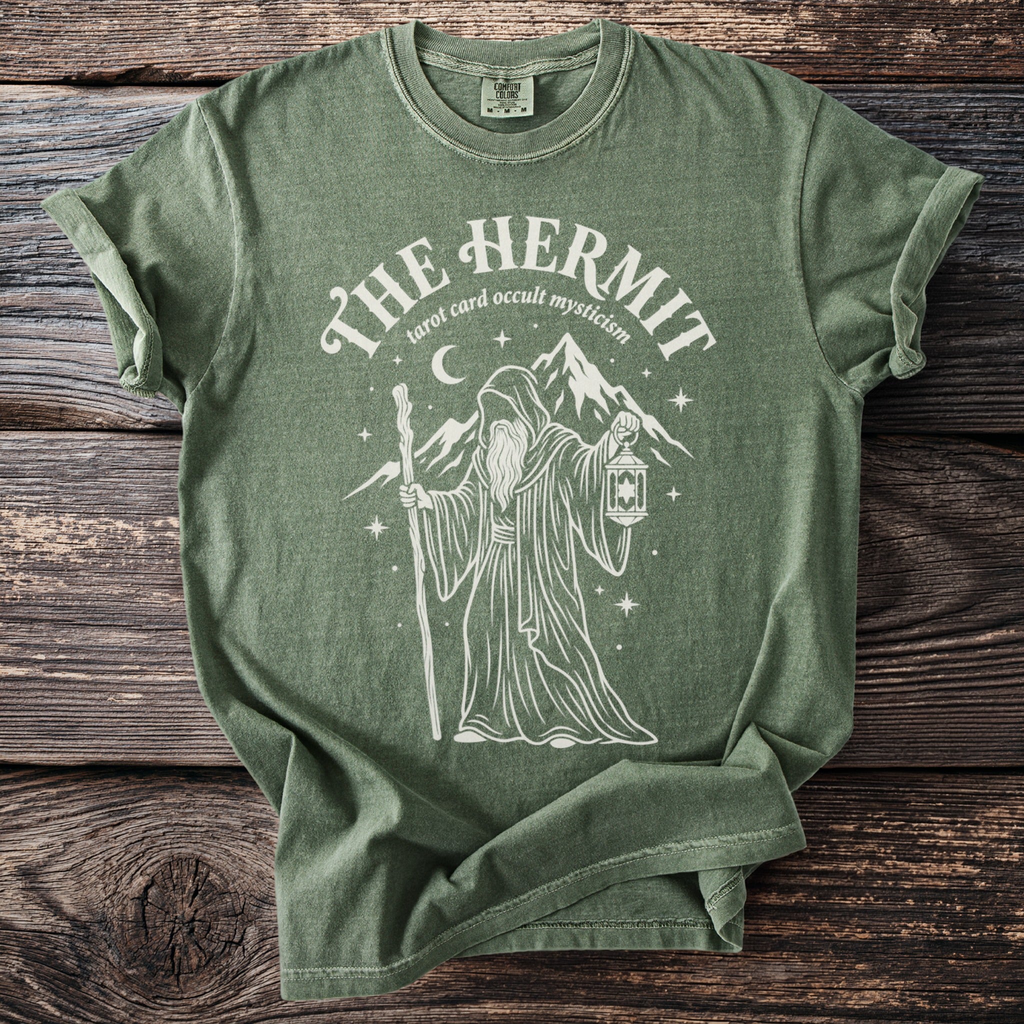 Green t-shirt with The Hermit tarot card occult mysticism graphic.