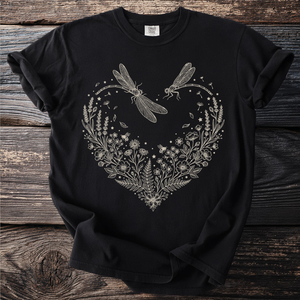 Black t-shirt with a cream line art heart design featuring dragonflies and flowers.