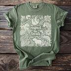 Green t-shirt with white graphic of jungle animals and text "respect the locals".