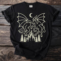 Black t-shirt with a cream-colored graphic of mythical creatures and fir trees.