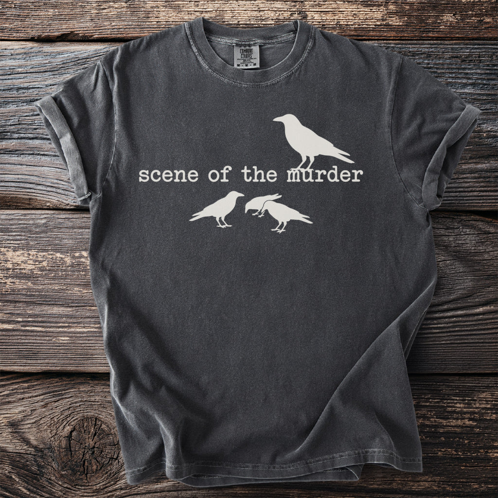 Dark grey t-shirt with white graphic of a single crow above text and three crows below.