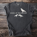 Dark grey t-shirt with white graphic of a single crow above text and three crows below.