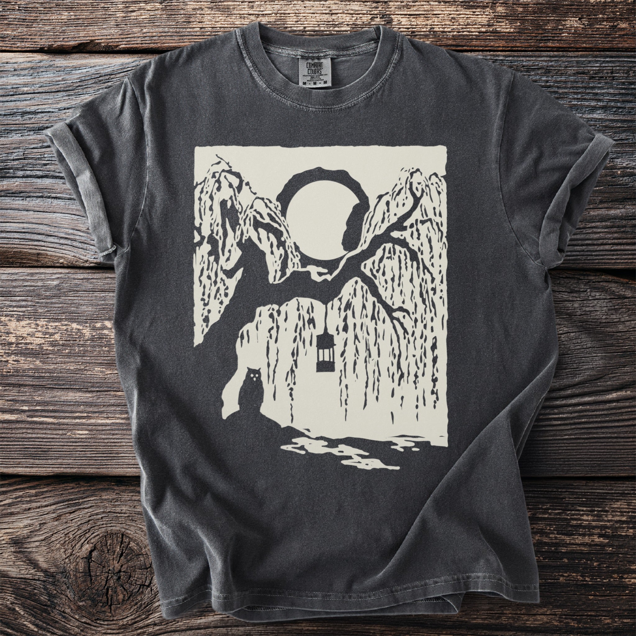 Dark gray t-shirt with a cream graphic of a seated cat beneath willow branches, a lantern, and a full moon.
