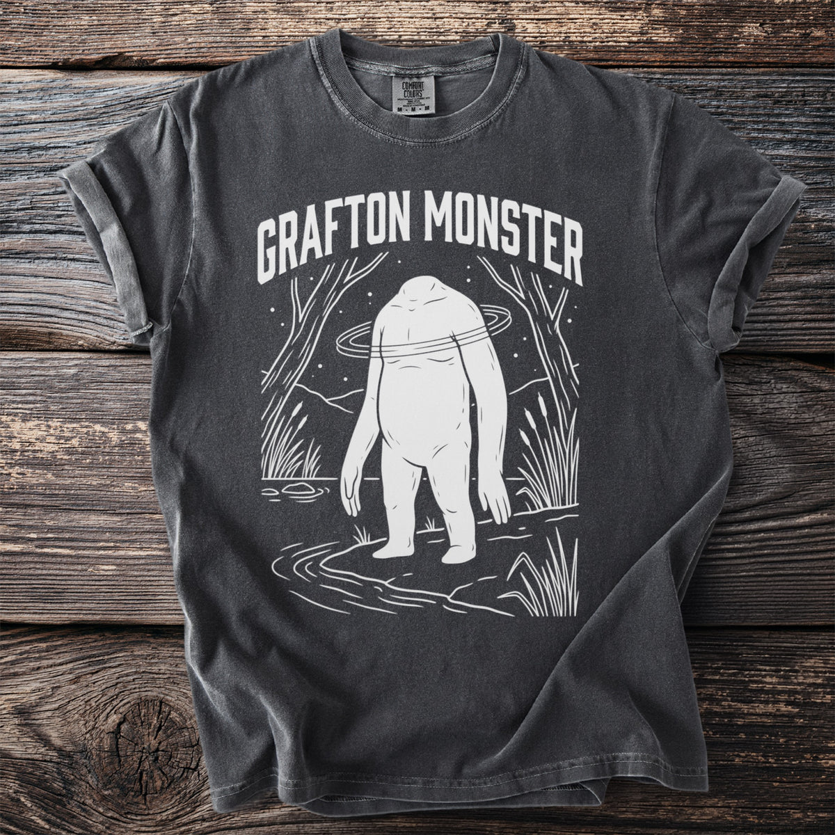 Dark gray t-shirt with "Grafton Monster" text and white Bigfoot graphic.