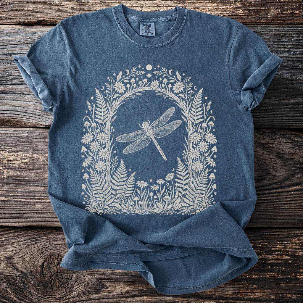 Blue t-shirt with white dragonfly and floral arch design.