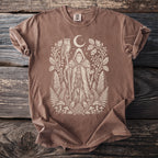 Brown t-shirt with a distressed print of a shaman in nature, an owl, and a moon.