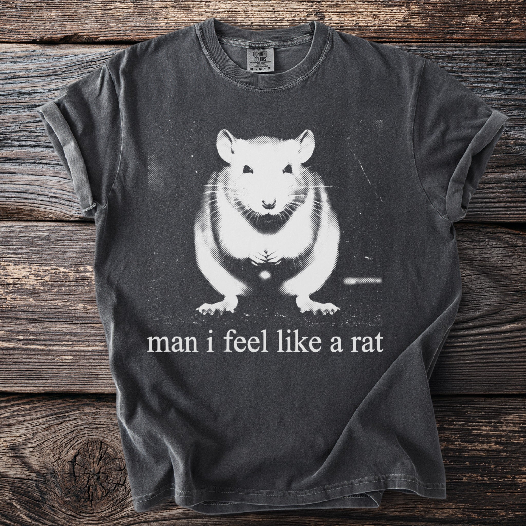 Dark gray t-shirt with white graphic of a rat and text "man i feel like a rat".