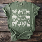 Green t-shirt with sketch-style farm animals and text "respect the locals".