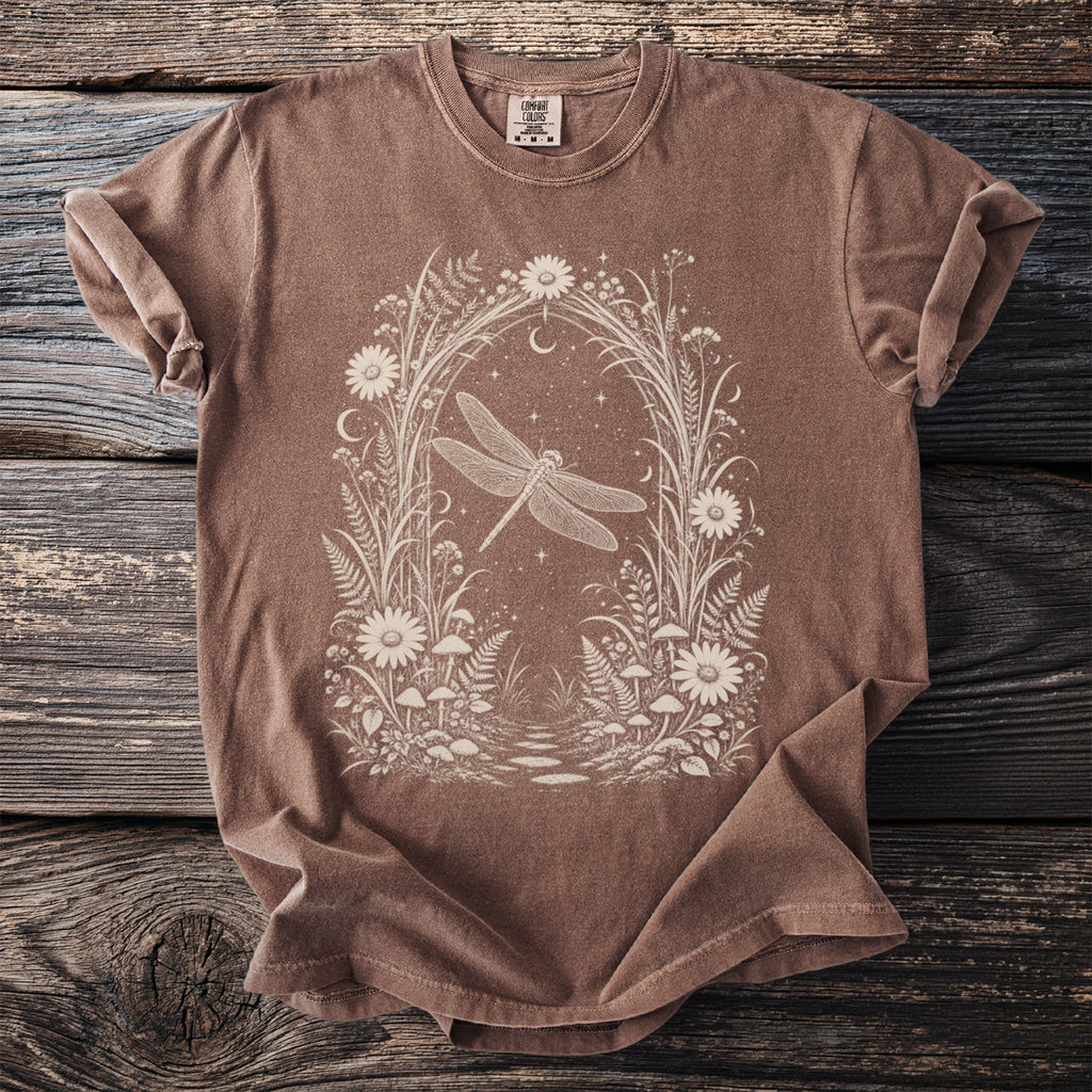Brown t-shirt with white dragonfly and floral arch design on front.
