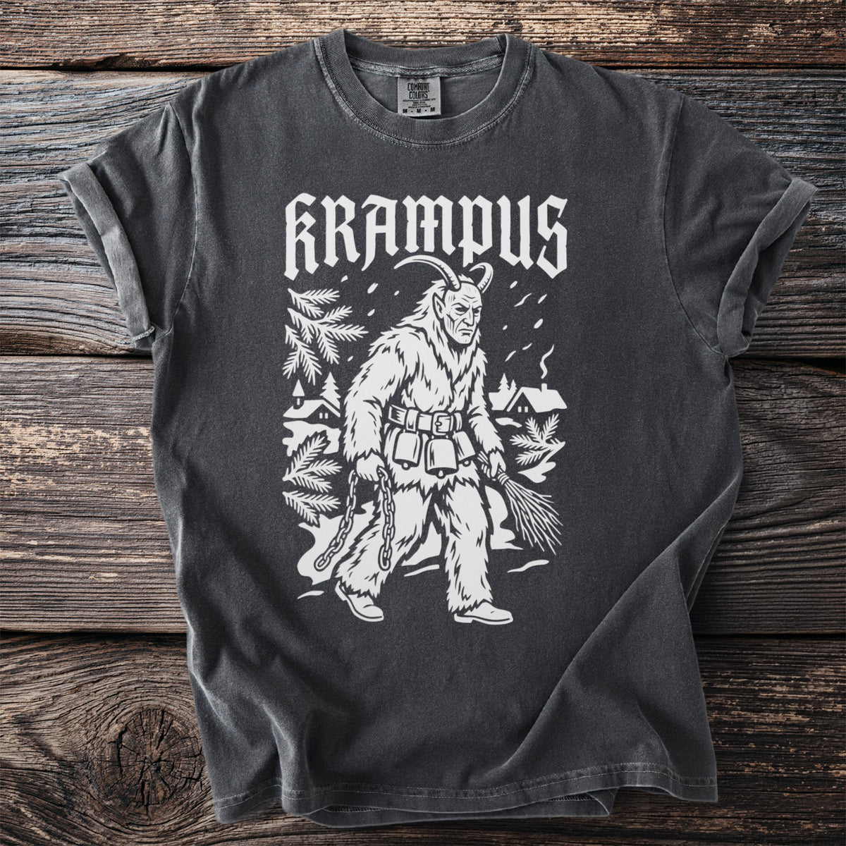 Dark t-shirt with white Krampus graphic, holding chains and birch branches.