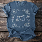 Blue t-shirt with floral border and "respect the locals" text