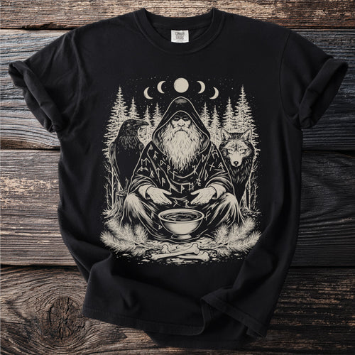 Black t-shirt with print of a hooded figure, raven, wolf, trees, and runes.