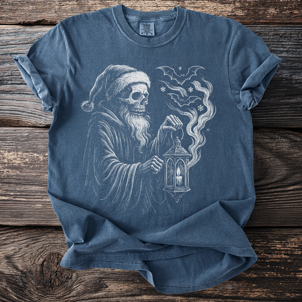 Skeleton in Santa hat holding lantern with bats and snowflakes on blue t-shirt.