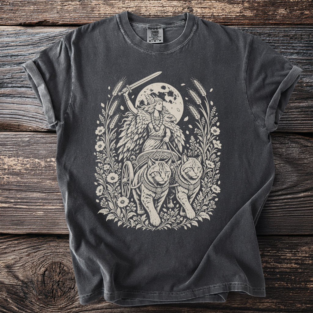 T-shirt with a vintage-style print of a woman with wings and a sword pulled by cats.